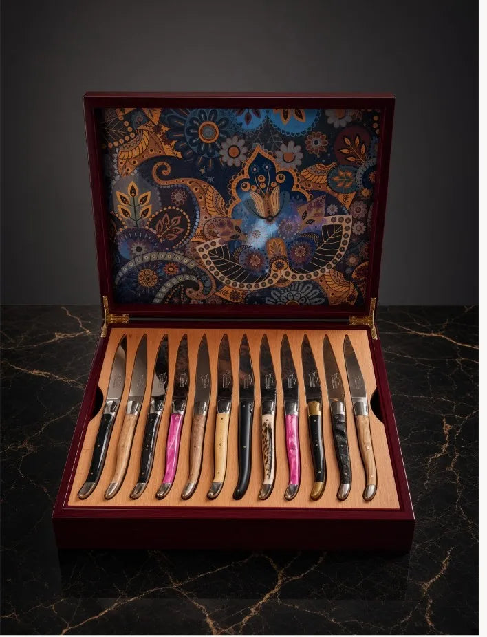 Custom steak knife set presented in an open wooden box